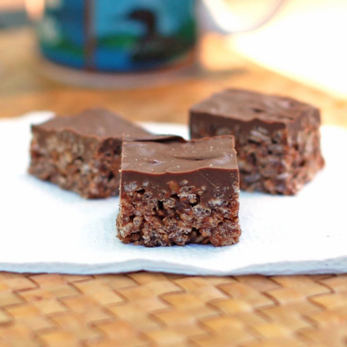 Chocolate scotcheroos on a napkin.
