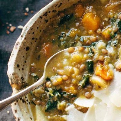 Detox Lentil Soup in a bowl with a spoon.