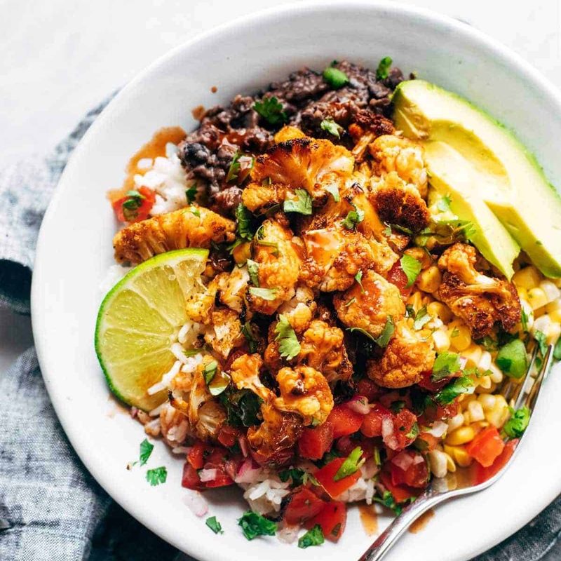 Roasted Cauliflower Burrito Bowl with toppings.