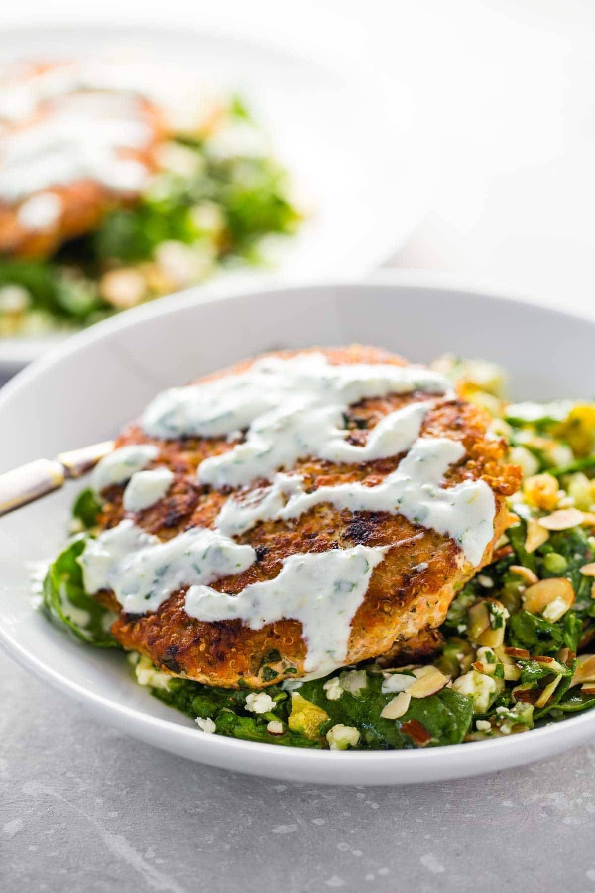 Lemon Herb Salmon Burger with sauce.