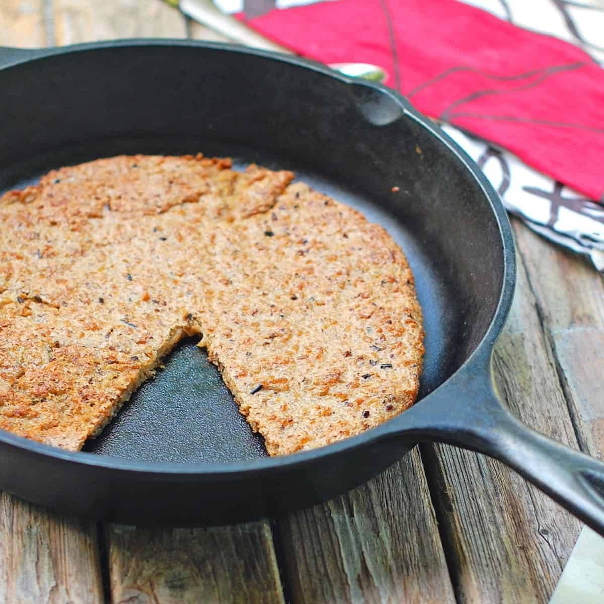 Wild rice flatbread in a skillet.