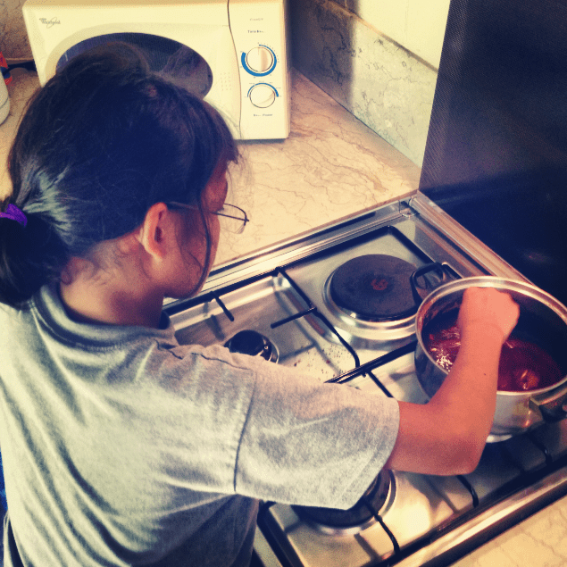 Young girl making Snickers cookies.