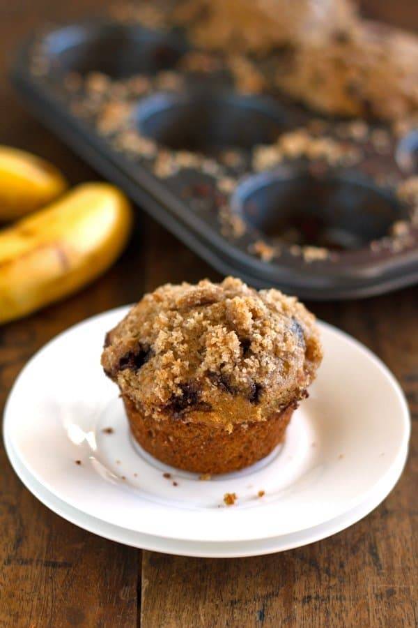 Chocolate chip banana peanut butter muffin on a plate.