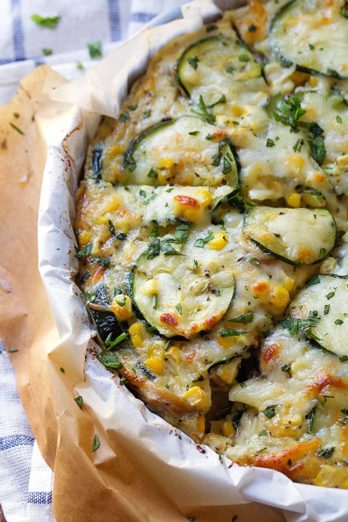 This crustless Sweet Corn and Zucchini Pie is so incredibly simple to make and it's the perfect way to enjoy summer produce! | pinchofyum.com