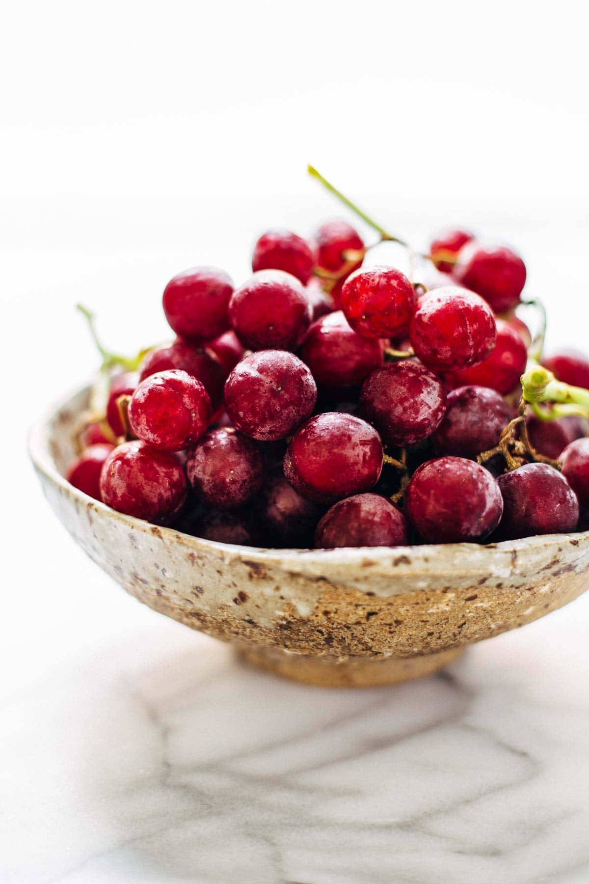 This Arugula Salad has grapes, cashews, pickled red onions, and a simple black pepper vinaigrette. Vegan, vegetarian, gluten free. | pinchofyum.com This Arugula Salad has grapes, cashews, pickled red onions, and a simple black pepper vinaigrette. Vegan, vegetarian, gluten free. | pinchofyum.com