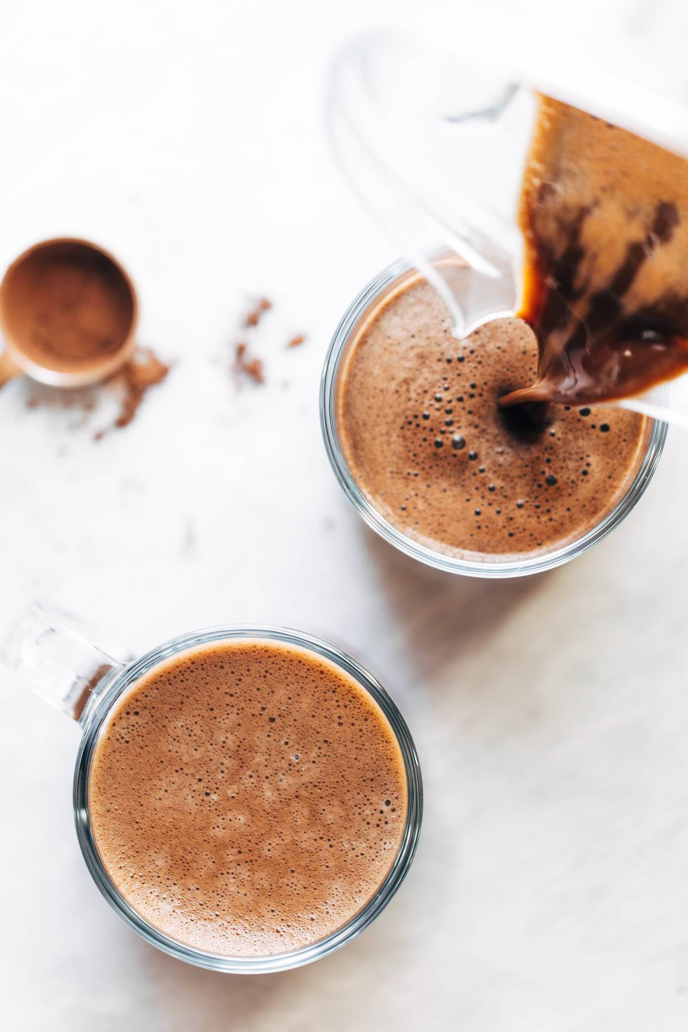 Pouring peppermint mocha into glass.