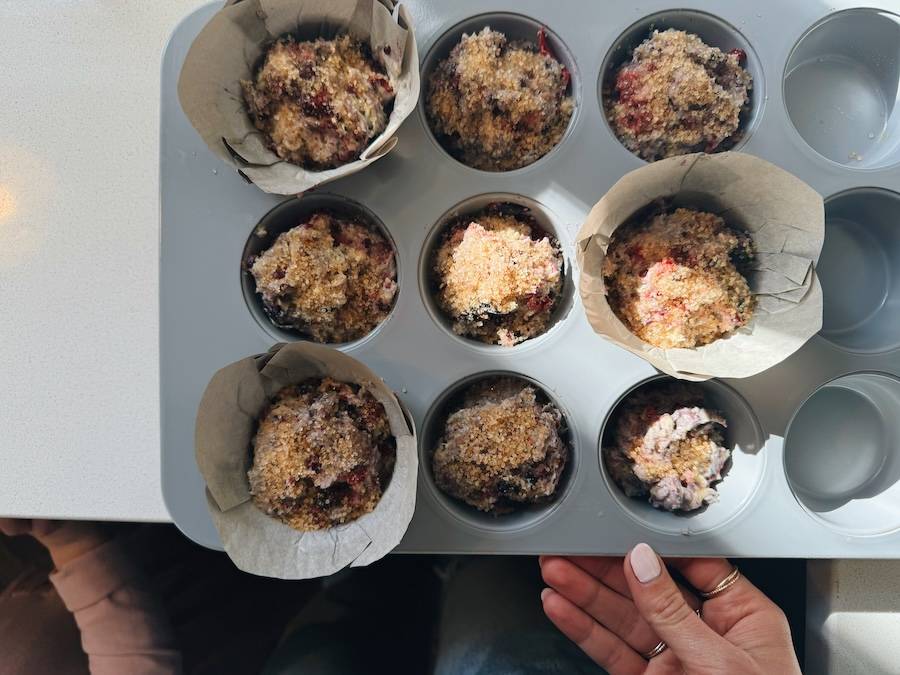 Muffins in paper-lined pan before baking.