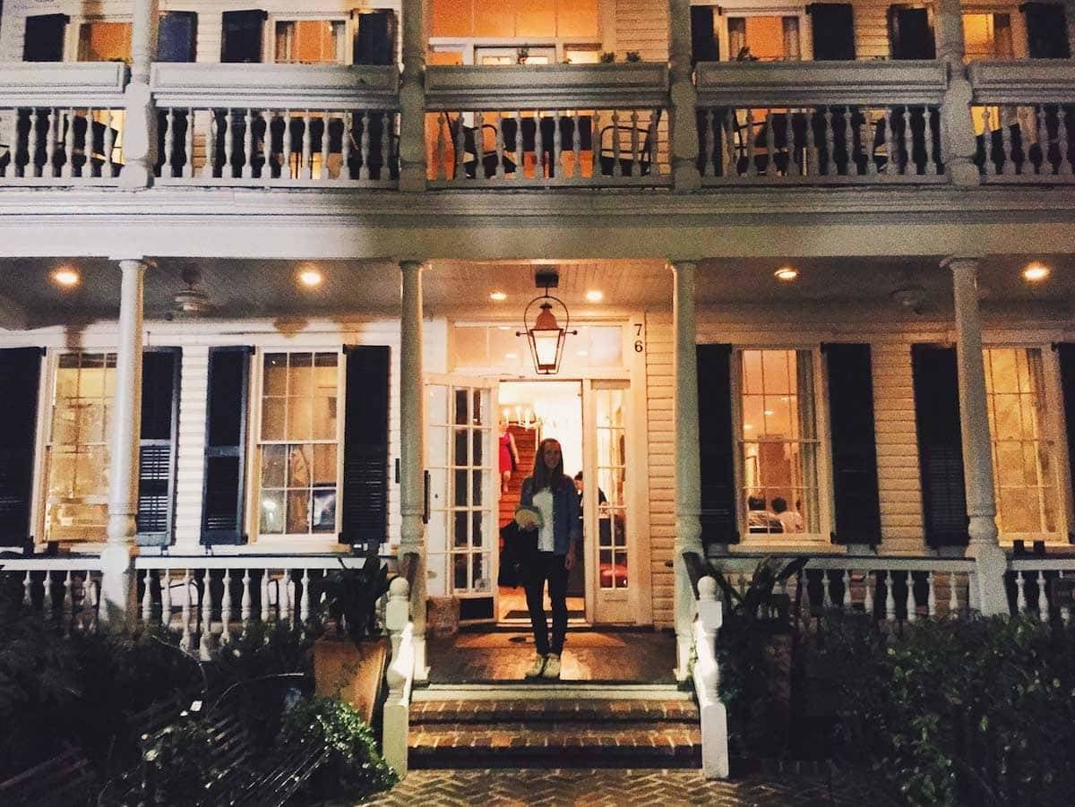 Woman standing on a porch.